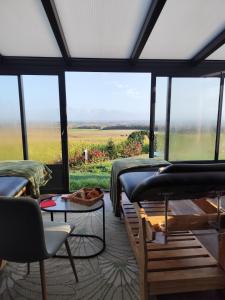 Et opholdsområde på chambre d'hôtes "Tipi en bois"