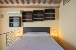 En eller flere senge i et værelse på Residenza La Chiusa 1984 by ElbaSummer