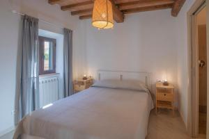En eller flere senge i et værelse på Residenza La Chiusa 1984 by ElbaSummer + 25 billeder