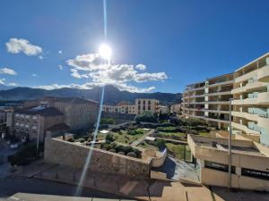 a view of a city with a street light at Coquet 2 pièces neuf Calvi Plage in Calvi