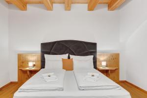 Postel nebo postele na pokoji v ubytování Alpin Chalet Samer Apt Berghütte