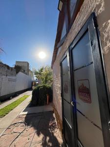 a door on the side of a building at Hostal Andino in Eugenio Bustos