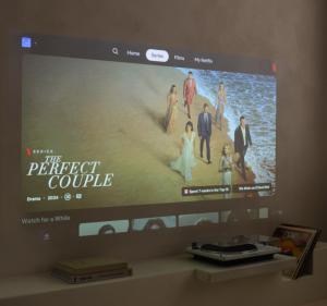 a flat screen tv hanging on a wall at Luxurious 1BR Apartment with Parking in Antwerp +23 photos