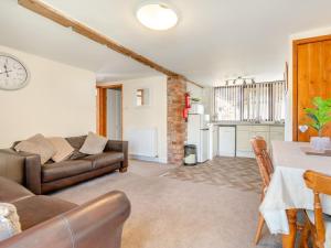 a living room with a couch and a table at 2 Bed in Newton-on-Rawcliffe 88955 in Newton