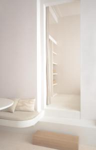 a white room with a bed and a window at Luxurious 1BR Apartment with Parking in Antwerp
