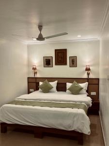 Ένα ή περισσότερα κρεβάτια σε δωμάτιο στο The Harmony Heritage Near Paltan Bazar