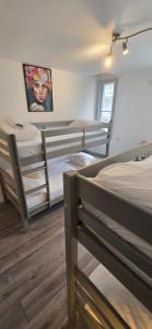 Postel nebo postele na pokoji v ubytování L'arcade Grand appart 10 pers-400m du sanctuaire 3 chambres 2 SDB arcade baby foot