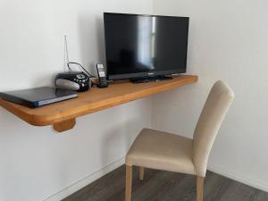 Un televizor și/sau centru de divertisment la Ferienwohnungen Hackl Ulrike