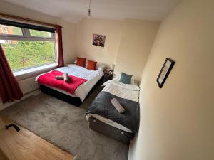 Ένα ή περισσότερα κρεβάτια σε δωμάτιο στο Cosy 3 Bedroom in Birmingham