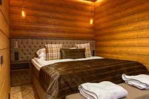 Ένα ή περισσότερα κρεβάτια σε δωμάτιο στο Wilderness Hotel Saariselkä
