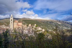 a town on the side of a hill with a church at Casa Vacanze Nonna Bambina in Palena