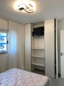 En eller flere senge i et værelse på J-H- DEPARTAMENTO