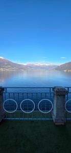 a view of a body of water with a railing at Casa Lago Como in Perledo