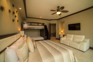 a bedroom with a bed and a bunk bed at Vista Bahia 3D - 3bdr 3bath plunge pool in La Mona +36 photos