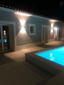 a house with a swimming pool at night at Casas Morgado in Valada