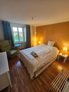 Ένα ή περισσότερα κρεβάτια σε δωμάτιο στο T1 Gästehaus Wohlen AG