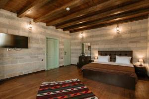 Ένα ή περισσότερα κρεβάτια σε δωμάτιο στο Old Baku Hotel
