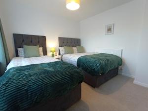 Ένα ή περισσότερα κρεβάτια σε δωμάτιο στο Cosy 3 bedroom house in Bicester