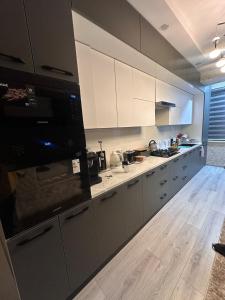 Η κουζίνα ή μικρή κουζίνα στο Cozy apartment in the Heart of Bukhara