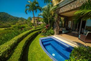 a swimming pool in the yard of a house at Vista Bahia 3F 1 bedr 1 1 and a half bath ocean view in La Mona