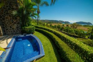 a swimming pool in the yard of a house at Vista Bahia 3F 1 bedr 1 1 and a half bath ocean view in La Mona