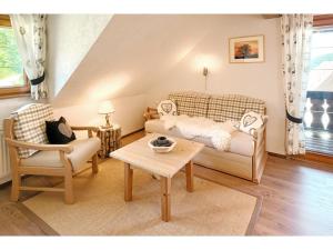 a living room with a couch and a table at Kirchlehof in Oberried