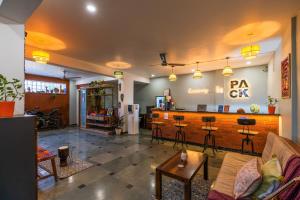 a lobby with a bar in a room at LiveAway Rishikesh, Laxman Jhula by PACK in Rishīkesh