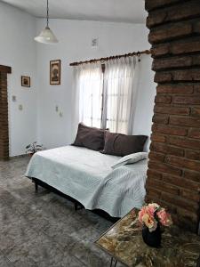 Ένα ή περισσότερα κρεβάτια σε δωμάτιο στο CASA PARA 5 CON PILETa +12 φωτογραφίες