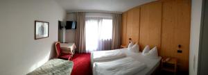 Postel nebo postele na pokoji v ubytování Hotel Rogen