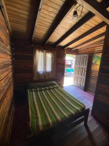 En eller flere senge i et værelse på Hospedaje Tiempo Azul