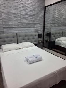 Ένα ή περισσότερα κρεβάτια σε δωμάτιο στο Brumas de Chipre Alojamiento +5 φωτογραφίες