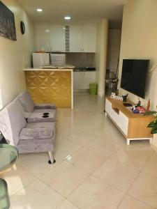 Un televizor și/sau centru de divertisment la Castelinho Sal Lodge