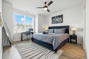 a bedroom with a bed and a ceiling fan at IRIE Living Brand New Lux 2BR Min Grand Park in Westfield +60 photos