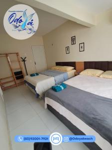 Ένα ή περισσότερα κρεβάτια σε δωμάτιο στο Pousada Odoyá Beach - Quádrupla