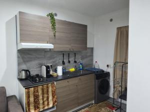 a kitchen with a sink and a counter top at Garibaldi guest house in Catania