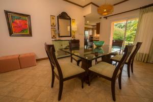 a dining room with a table and chairs at Veranda 8F - 2 bdr 2 bath - Condo in Isla Herradura