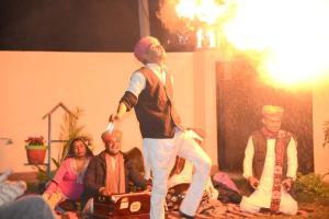 a man playing a video game with a wii controller at The Ranthambore Samrajya Tiger Seven in Sawāi Mādhopur +34 photos