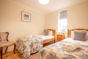 Postel nebo postele na pokoji v ubytování Golf Court No 5 - Elie