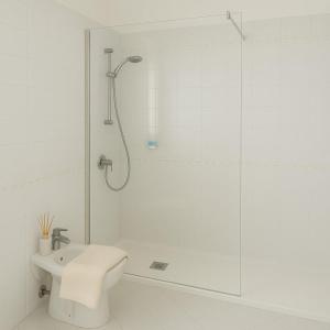 a bathroom with a shower and a toilet and a sink at Appartamento in Villa Monaco in Mosciano SantʼAngelo