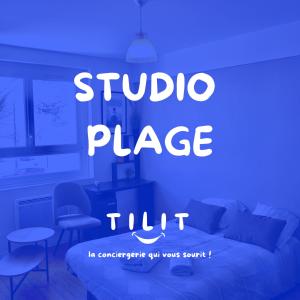 a bed in a room with a blue light at Studio Plage in Le Perrey