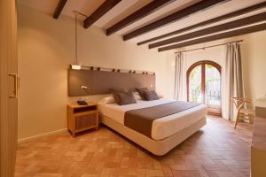 Ένα ή περισσότερα κρεβάτια σε δωμάτιο στο Petit Hotel Ses Rotges - Only Adults