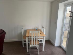 a dining room with a table and two chairs at Lantern House in Bristol