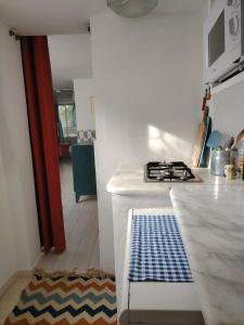 a kitchen with a stove and a counter top at Sidi Bou House in Sidi Bou Saïd