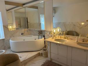 a large bathroom with two sinks and a tub at Villa Adele Città Sant'Angelo in Citta' Sant'Angelo +31 photos