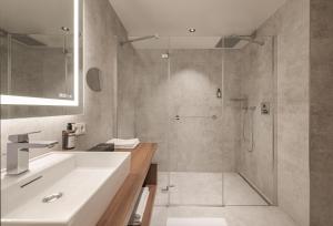 Phòng tắm tại Hotel Schwarzer Adler Innsbruck