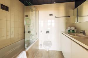 Ένα μπάνιο στο harry's home Hart bei Graz hotel & apartments