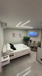 Ένα ή περισσότερα κρεβάτια σε δωμάτιο στο Flats do Cabo e Suítes