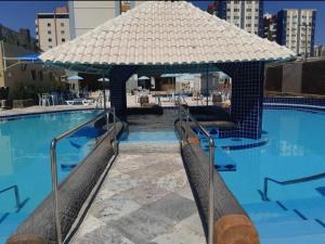 Πισίνα στο ή κοντά στο Caldas Novas Eldorado flat service +8 φωτογραφίες