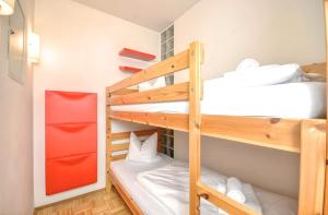 a bunk bed room with two bunk beds at Kitzsteinhorn Kaprun Panorama in Dürnberg