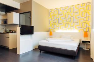 Ένα ή περισσότερα κρεβάτια σε δωμάτιο στο harry's home Dornbirn hotel & apartments +28 φωτογραφίες